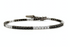 Black and white diamond tennis bracelet in 18K gold by Diamond Tales