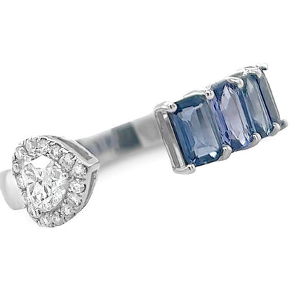 18k white gold open band ring with four emerald-cut blue sapphires and a diamond heart motif