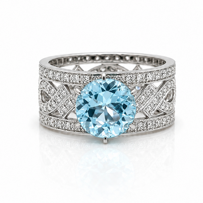 18k gold ring with round blue topaz and diamonds