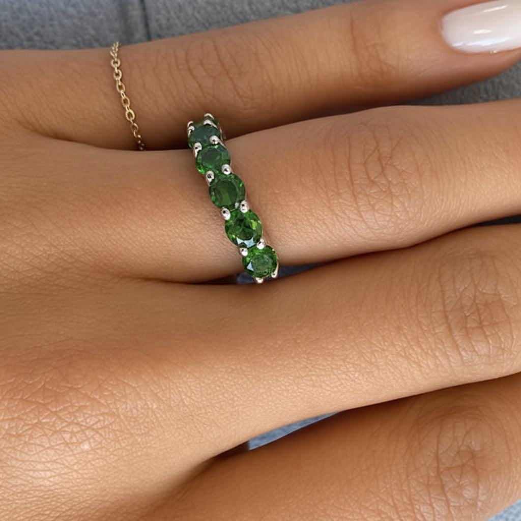 18k white gold band ring with seven round chrome diopside gemstones