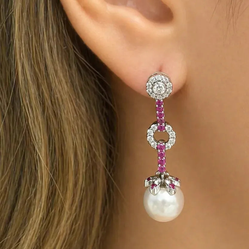 18k white gold earrings with pink sapphires, South Sea pearl drops, and detachable diamond tops