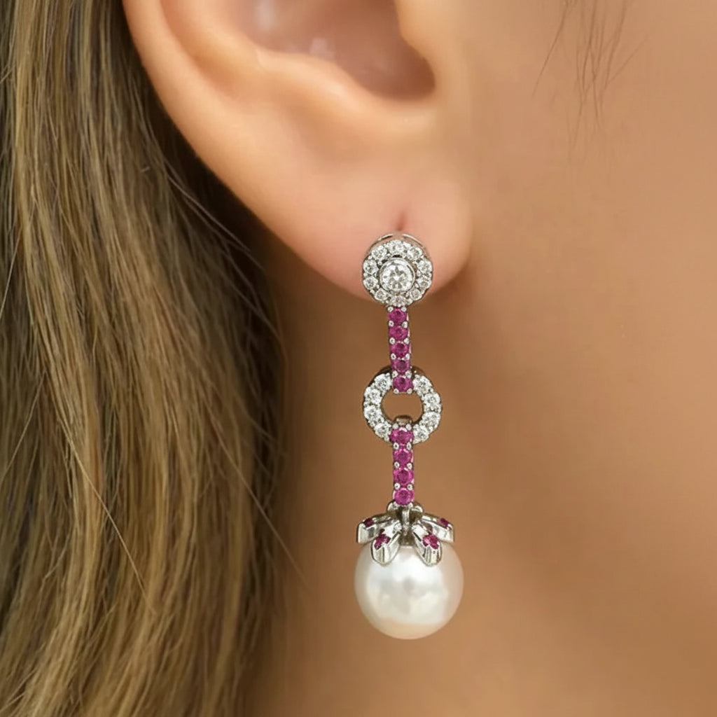 18k white gold earrings with pink sapphires, South Sea pearl drops, and detachable diamond tops