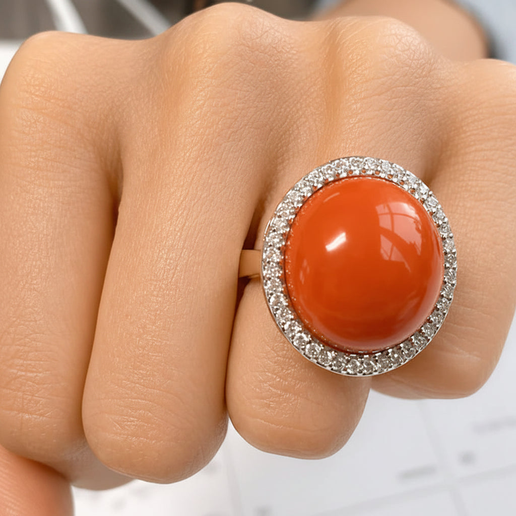 18k gold ring with coral cabochon and round diamond accents