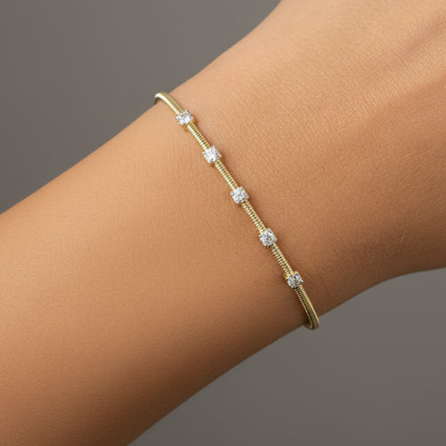 diamond bangle bracelet in 14k yellow gold with diamond accents