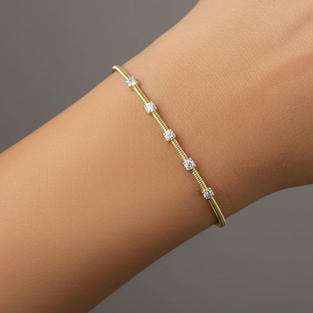 diamond bangle bracelet in 14k yellow gold with diamond accents