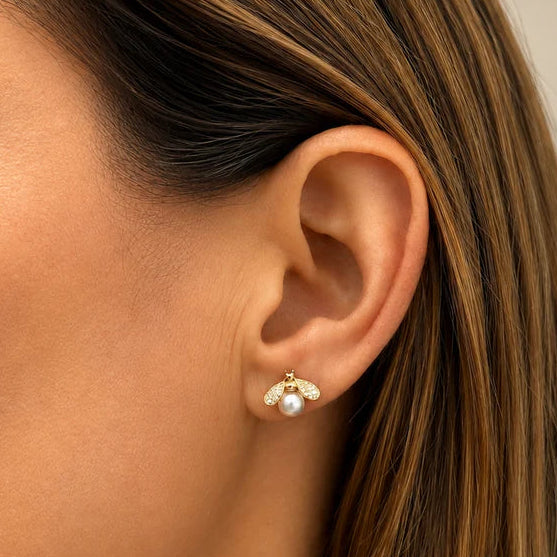 diamond bee and pearl stud earrings in 14k gold with diamond accents