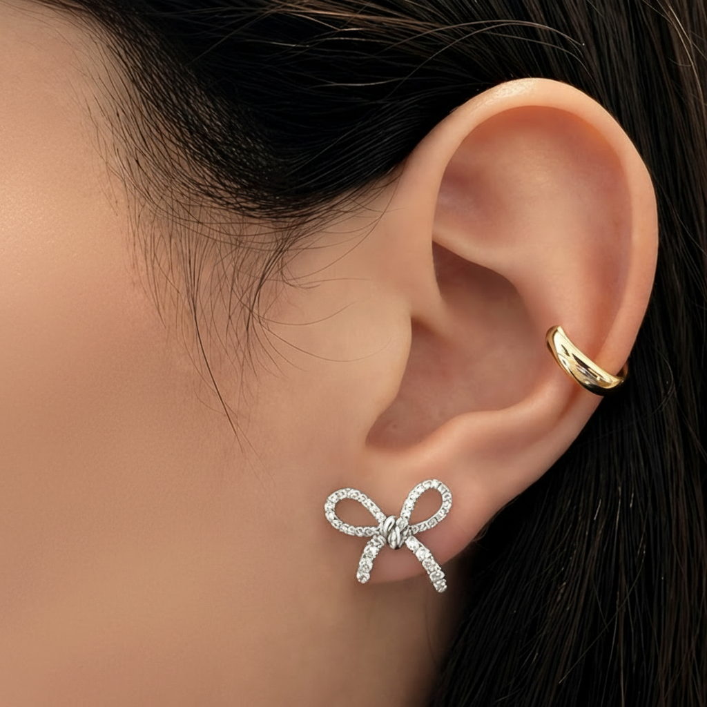 18k white gold diamond bow earrings by Diamond Tales