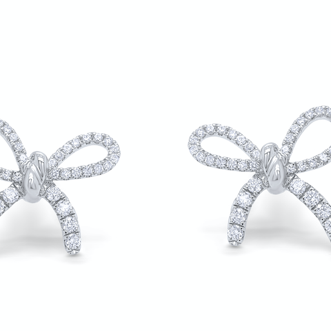 18k white gold diamond bow earrings by Diamond Tales