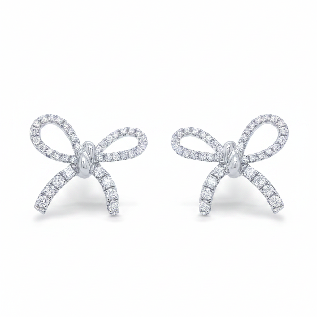 18k white gold diamond bow earrings by Diamond Tales