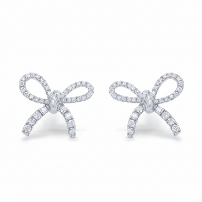 18k white gold diamond bow earrings by Diamond Tales
