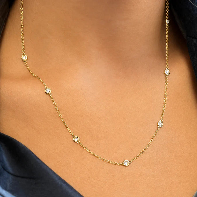 18k yellow gold Diamond by the Yard necklace with bezel-set diamond stations on a fine chain