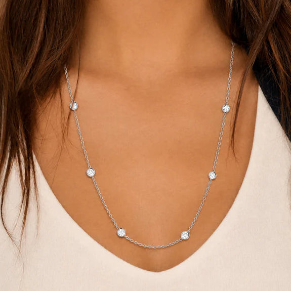 18k white gold Diamond by the Yard necklace with 17 bezel‑set diamonds on a 21.5‑inch chain