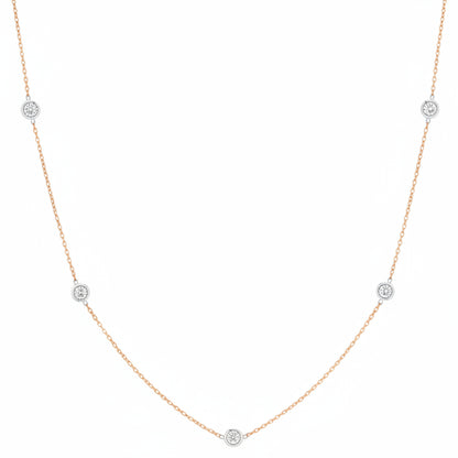 18k rose gold necklace with evenly spaced bezel‑set diamonds on a 24‑inch chain