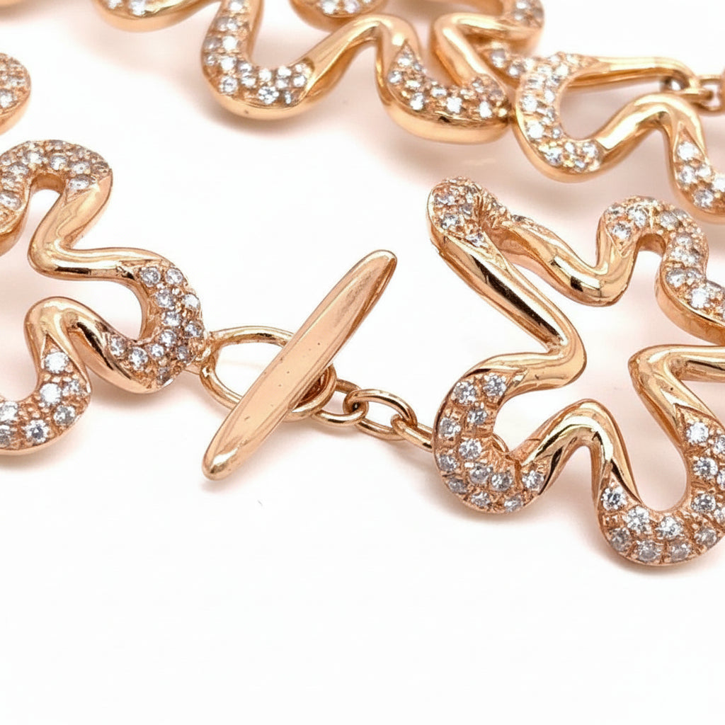 diamond flower bracelet in 18k rose gold with floral motifs