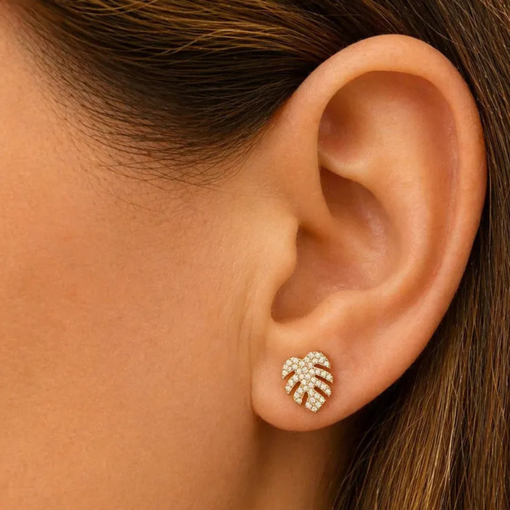 diamond leaf stud earrings in 14k yellow gold with diamond accents