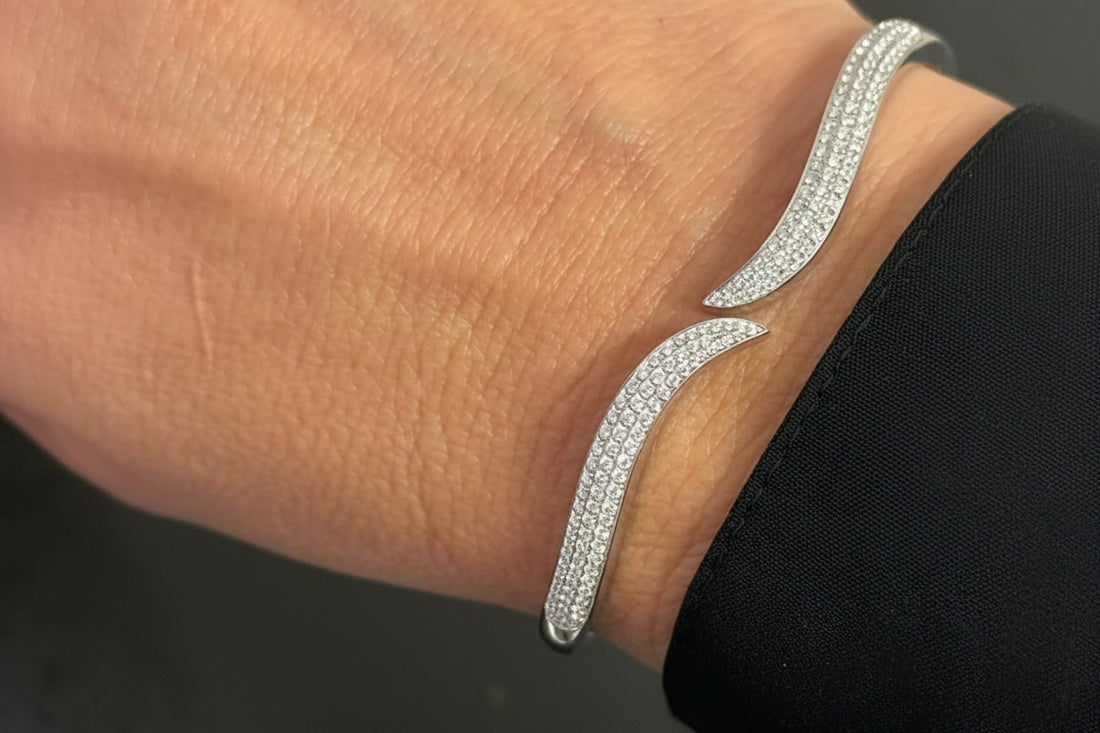 18k white gold open bangle bracelet with round brilliant diamonds by Diamond Tales