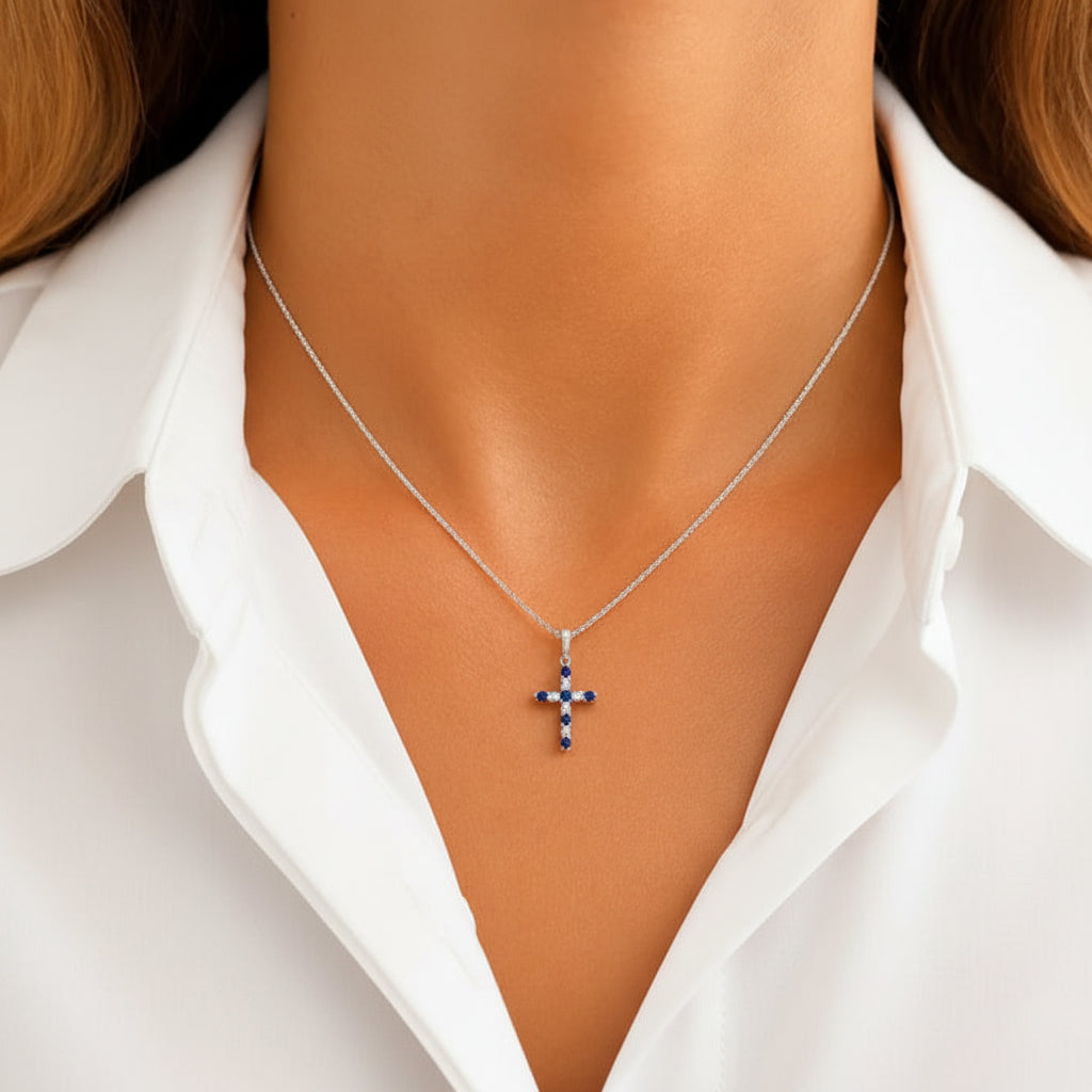 18k gold cross pendant with round brilliant diamonds and blue sapphires by Diamond Tales