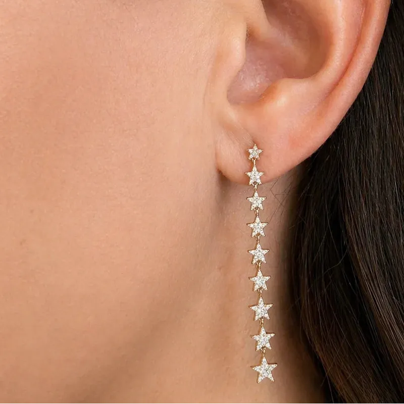diamond star inline drop earrings in 14k gold with star motifs
