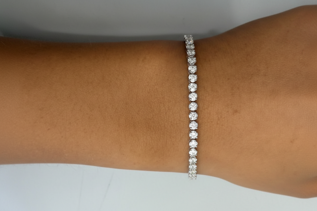 18k white gold tennis bracelet with 57 round brilliant diamonds by Diamond Tales