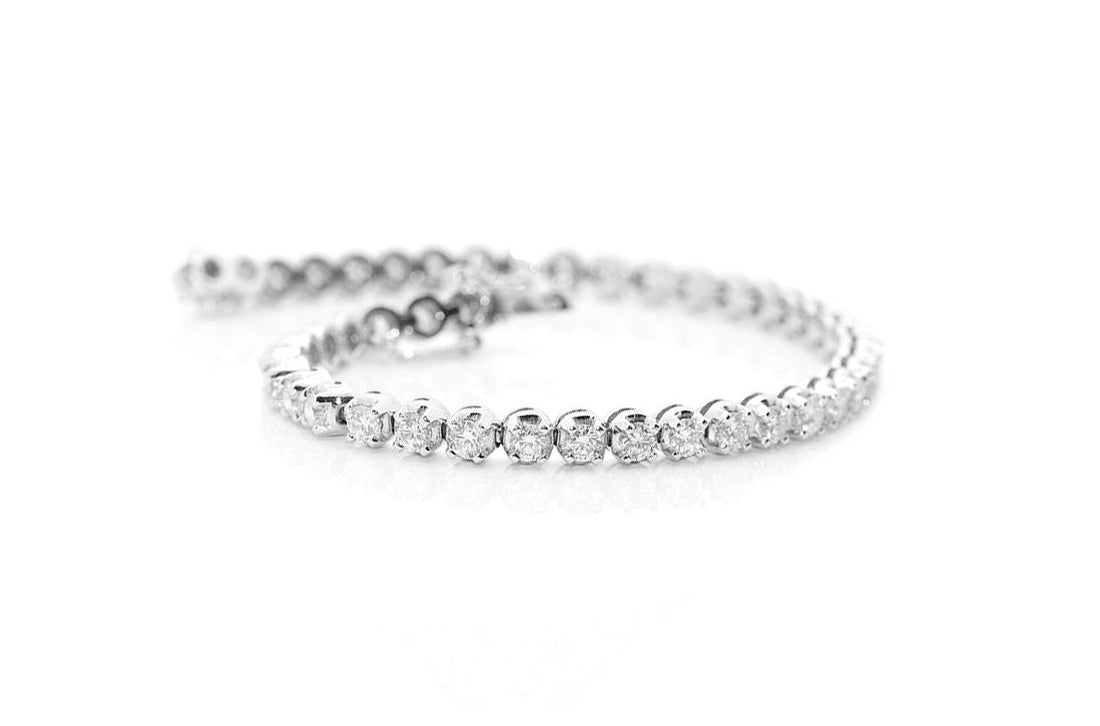 18k white gold tennis bracelet with 57 round brilliant diamonds by Diamond Tales
