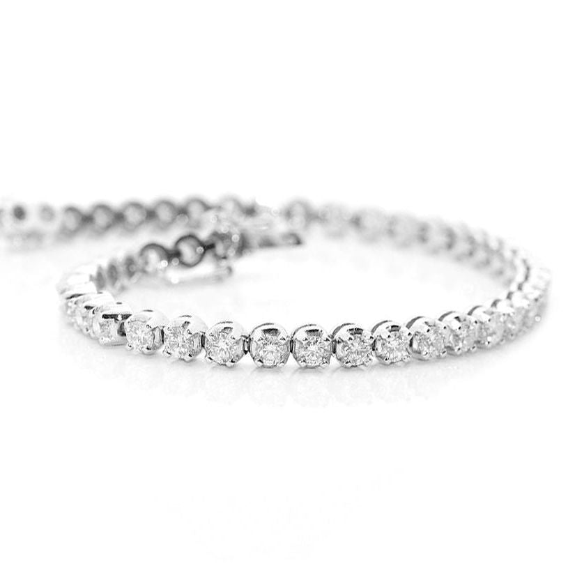 18k white gold tennis bracelet with 57 round brilliant diamonds by Diamond Tales