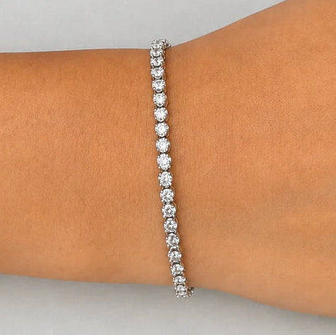 18k white gold tennis bracelet with 57 round brilliant diamonds by Diamond Tales