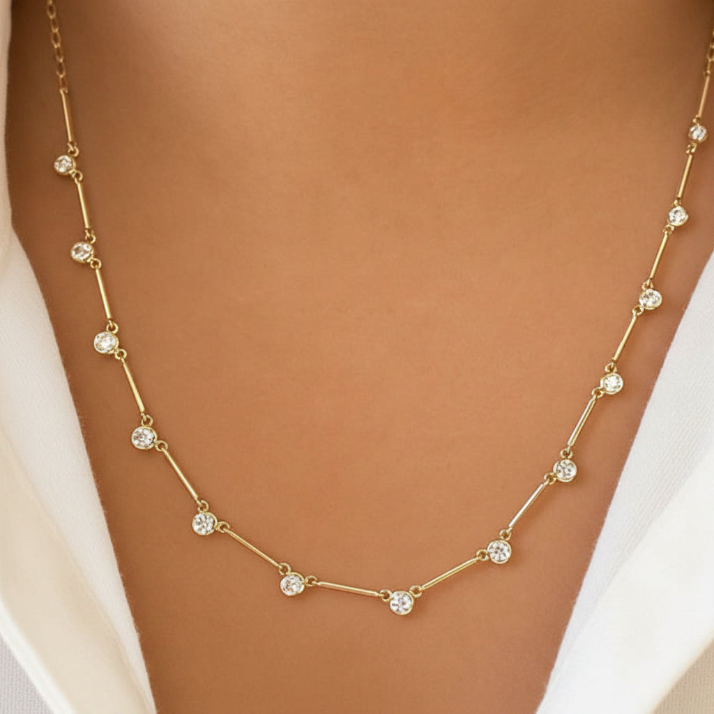 diamond triangle station necklace in 14k gold with geometric triangle motifs