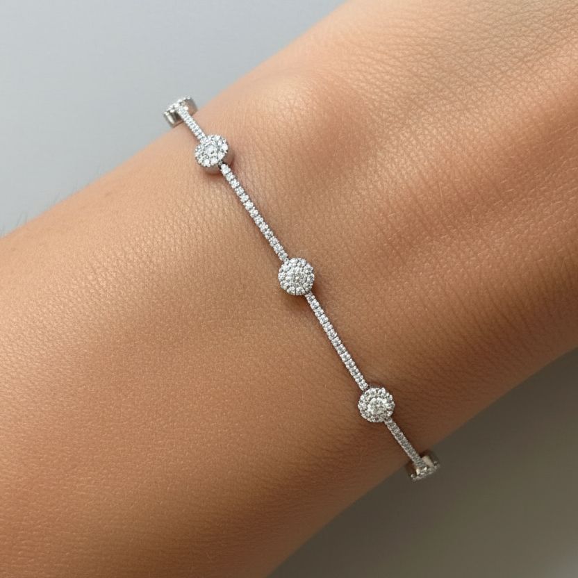 18k white gold bracelet with gold dots and round brilliant diamonds by Diamond Tales