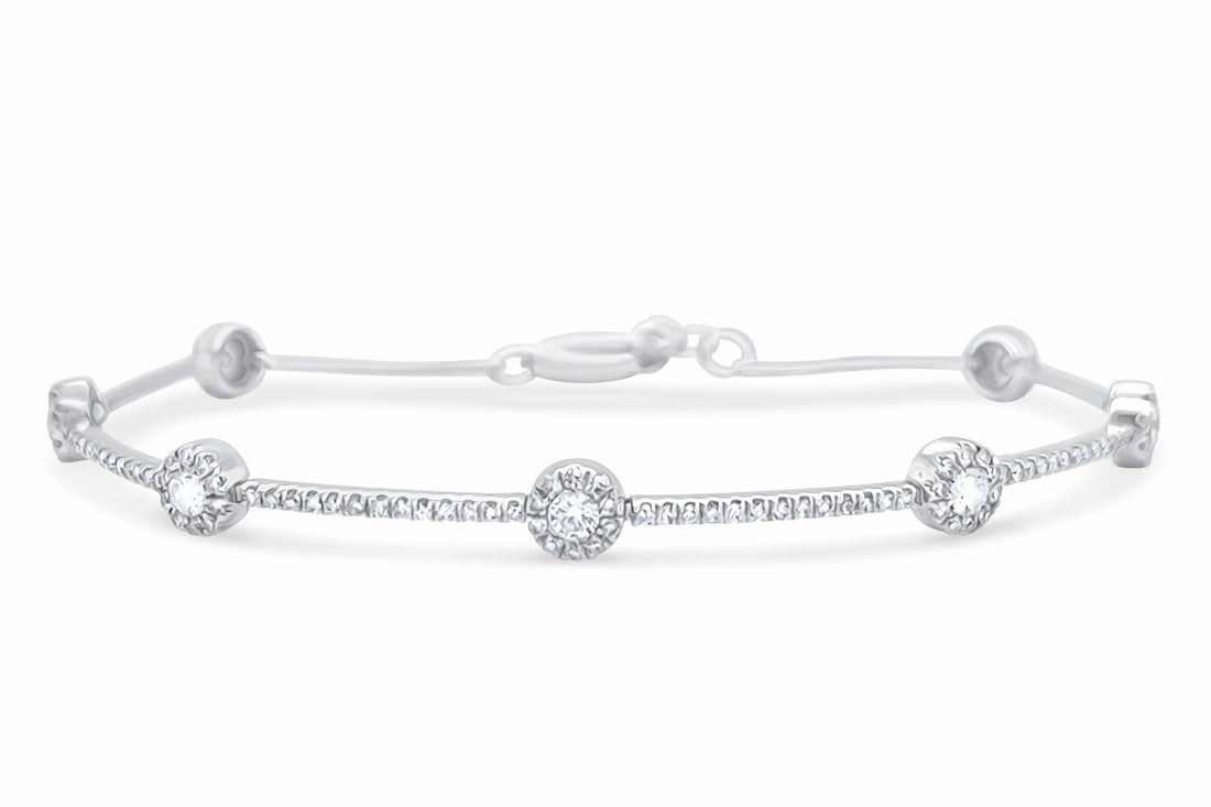18k white gold bracelet with gold dots and round brilliant diamonds by Diamond Tales