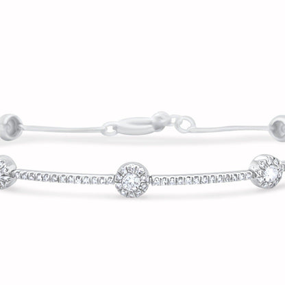 18k white gold bracelet with gold dots and round brilliant diamonds by Diamond Tales