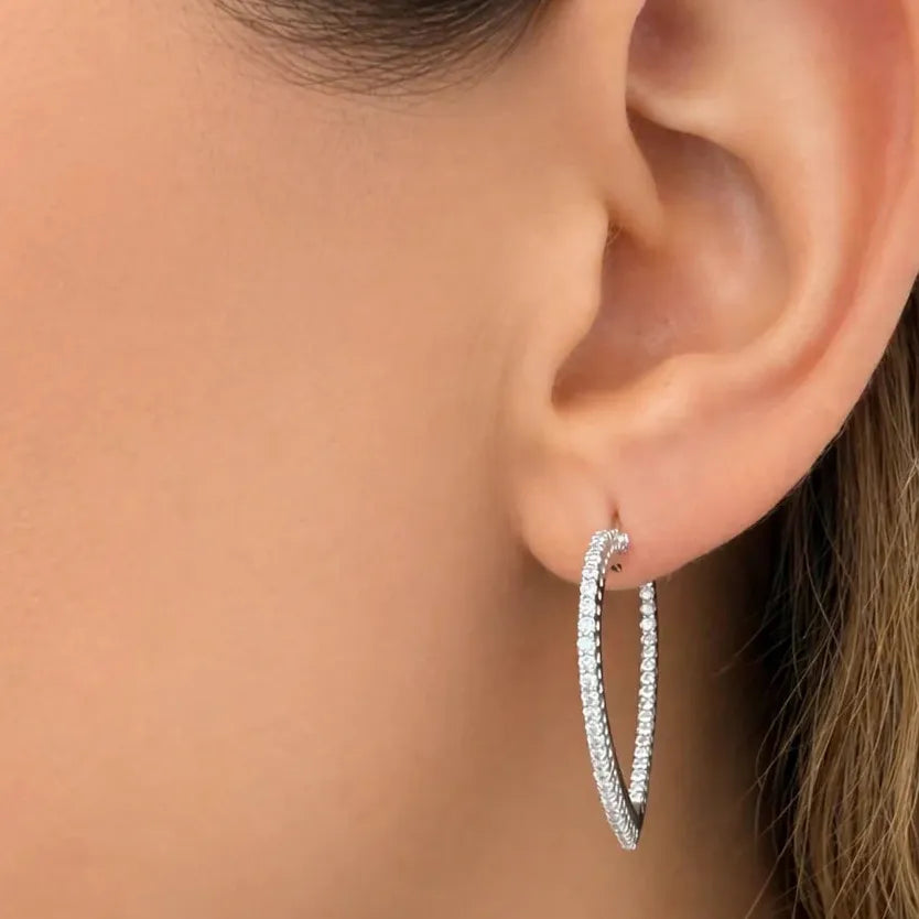 18k yellow gold heart-shaped hoop earrings pavé-set with round brilliant diamonds