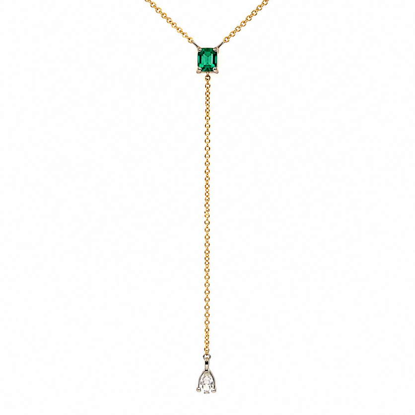 pear shaped diamond drop with bezel set diamond accents, close up