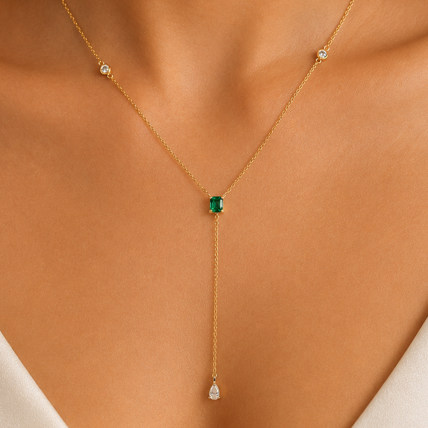 emerald and diamond drop necklace in 14k yellow gold, detail view