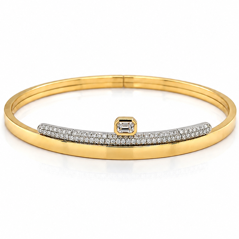 18k two-tone gold bangle bracelet with a central emerald-cut diamond and pave diamonds