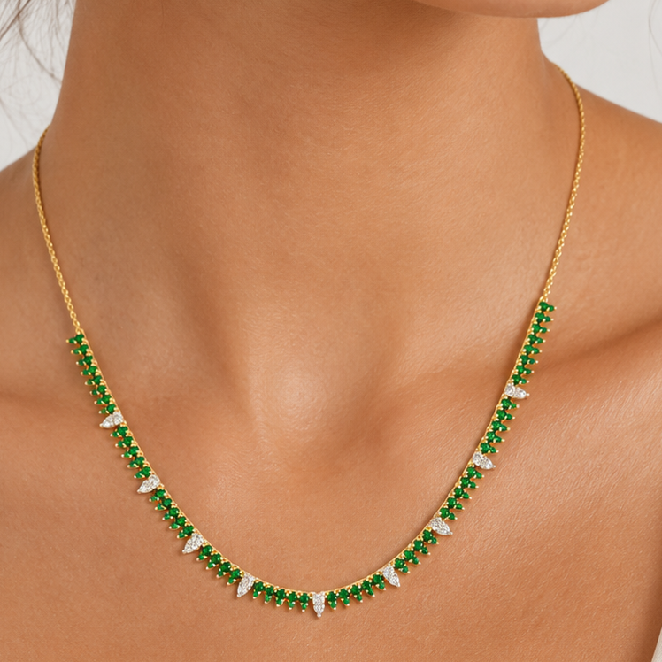Detail of the matched emerald and diamond line setting