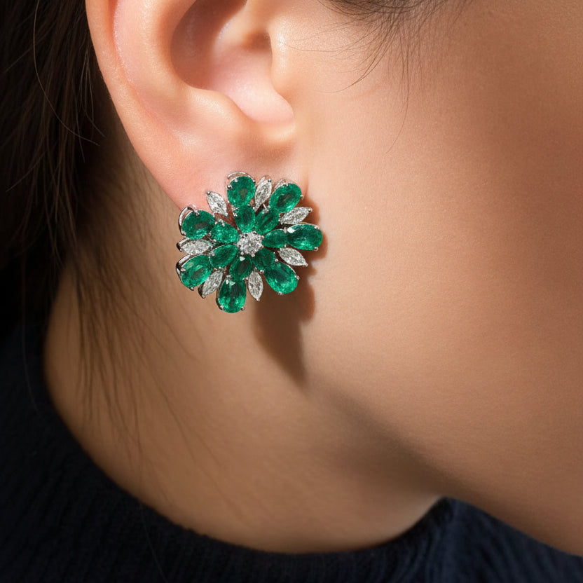 18k white gold flower earrings with emerald petals and diamond accents