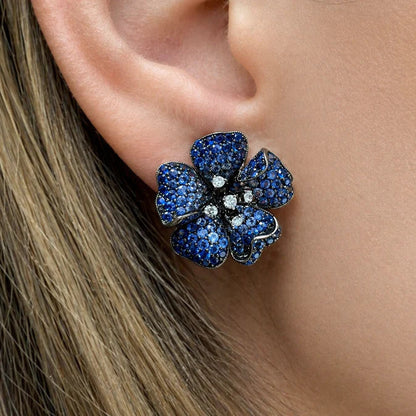 18k white gold flower earrings with gradient blue sapphires and diamond accents