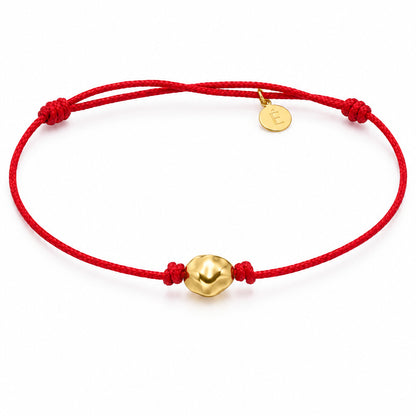 18k yellow gold hammered nugget bracelet on adjustable red macramé cord