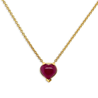 18k yellow gold necklace featuring a heart-shaped ruby cabochon pendant