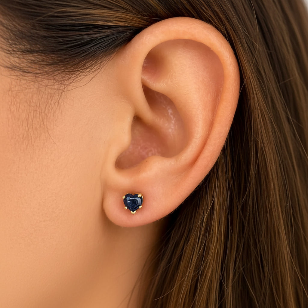 14k yellow gold stud earrings featuring heart-shaped blue sapphire cabochons
