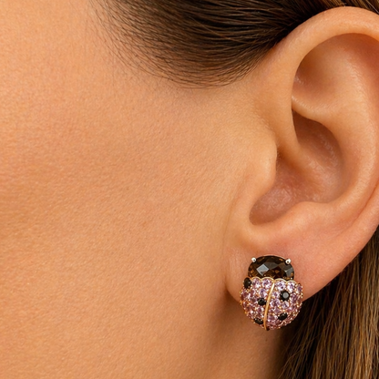 18k gold ladybug earrings with pink sapphires and black diamonds by Diamond Tales