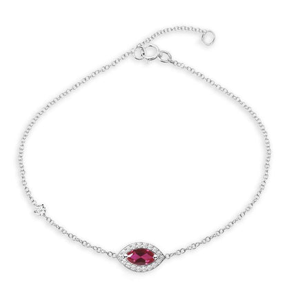 18k gold chain bracelet with a marquise gemstone centerpiece framed by pavé diamonds
