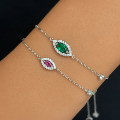 18k gold chain bracelet with a marquise gemstone centerpiece framed by pavé diamonds