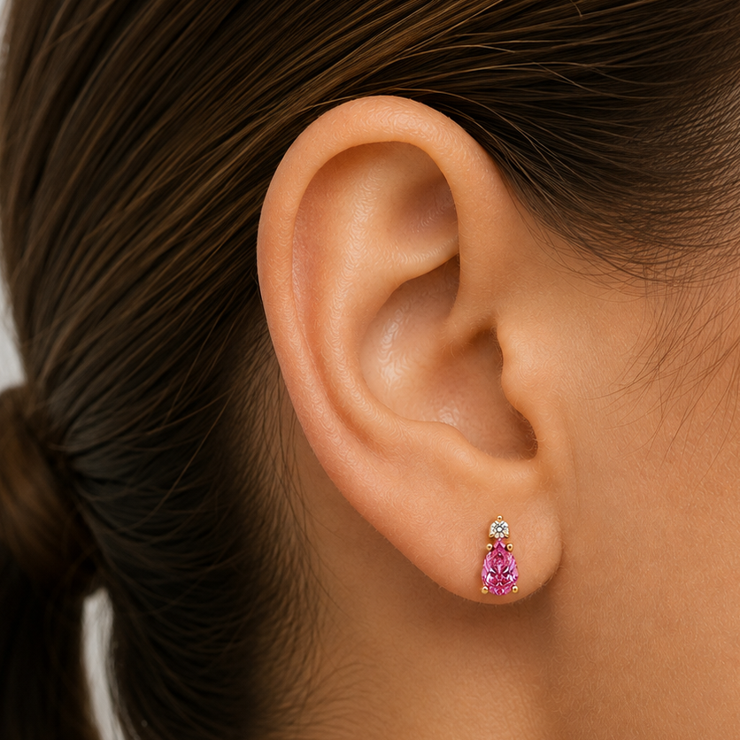 Macro detail of the pear-shape pink sapphire and round diamond setting