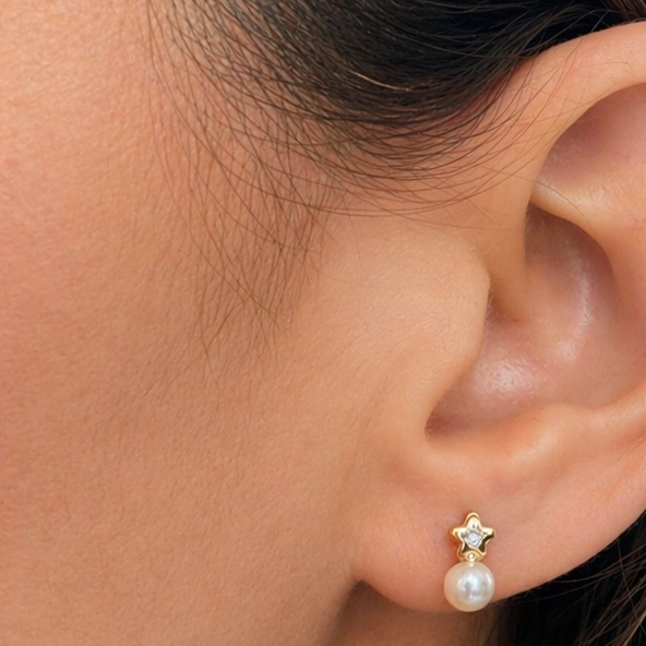 18k gold mini flower stud earrings with pearls and center diamonds by Diamond Tales