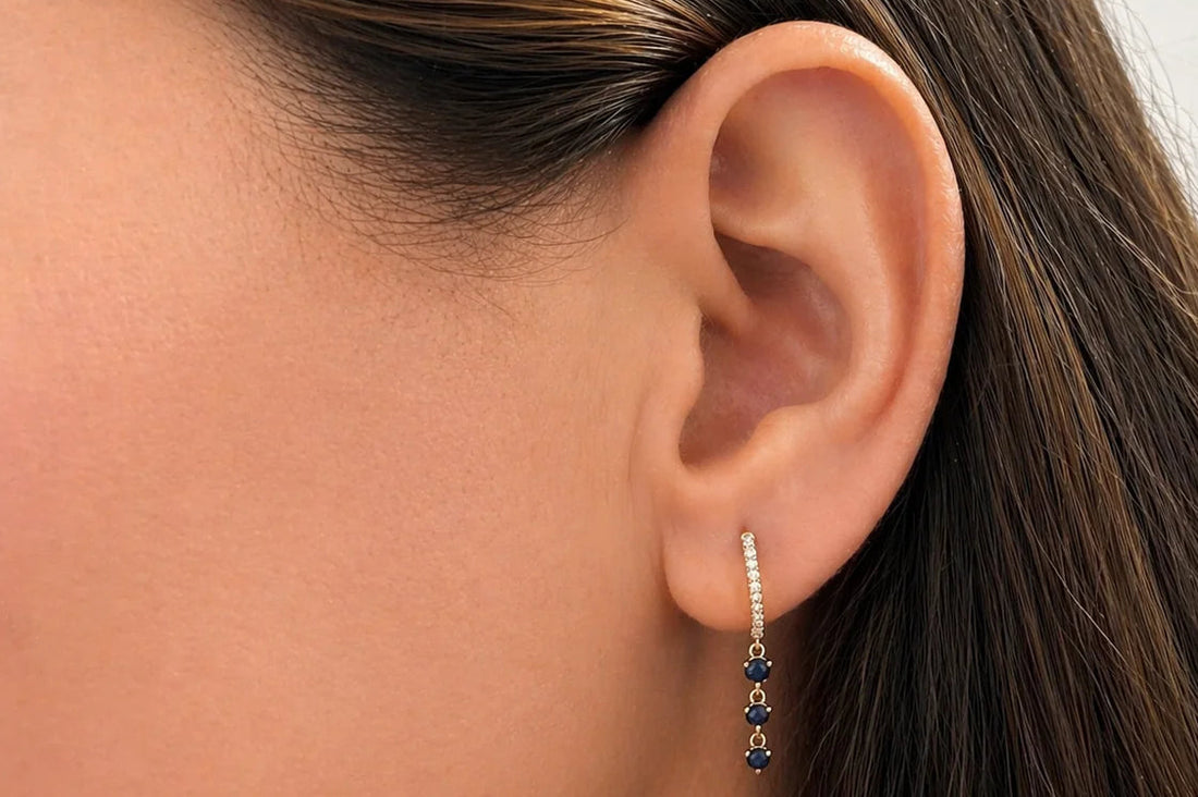 mini sapphire and diamond hoop earrings in 14k gold with blue sapphires and diamond accents