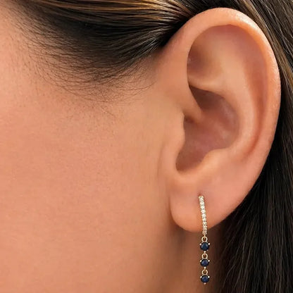 mini sapphire and diamond hoop earrings in 14k gold with blue sapphires and diamond accents