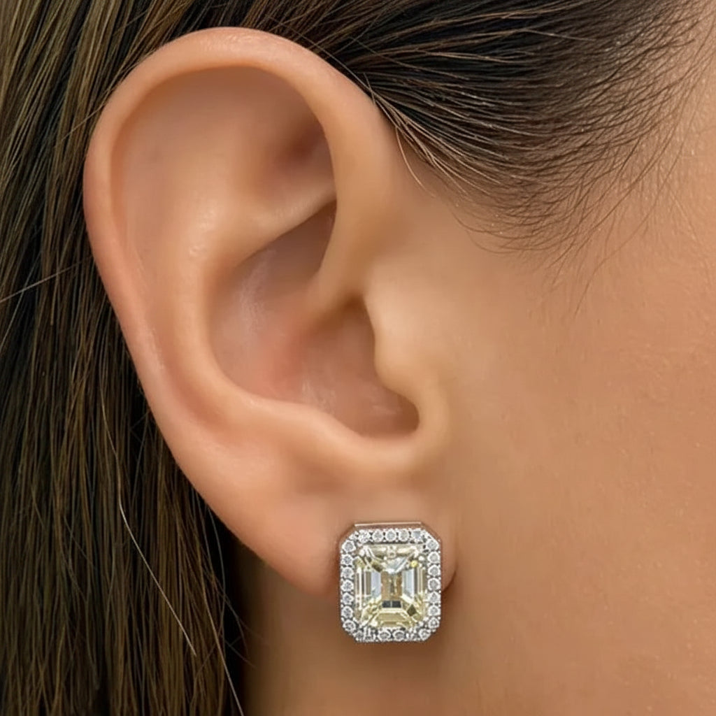 18k white gold earrings with GIA-certified emerald-cut diamonds and pavé-set round diamonds