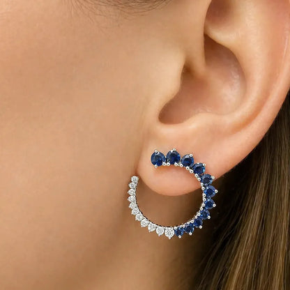18k gold open-circle stud earrings with blue sapphires and diamond accents