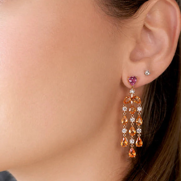 18k gold chandelier earrings with pear-shaped orange sapphires and diamond accents